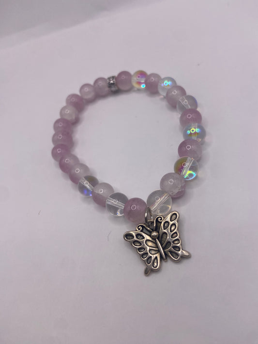 Beaded white and pink bracelet with butterfly charm