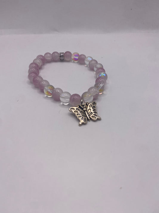 Beaded white and pink bracelet with butterfly charm